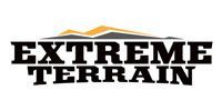 A logo for extreme terrain with a mountain in the background.