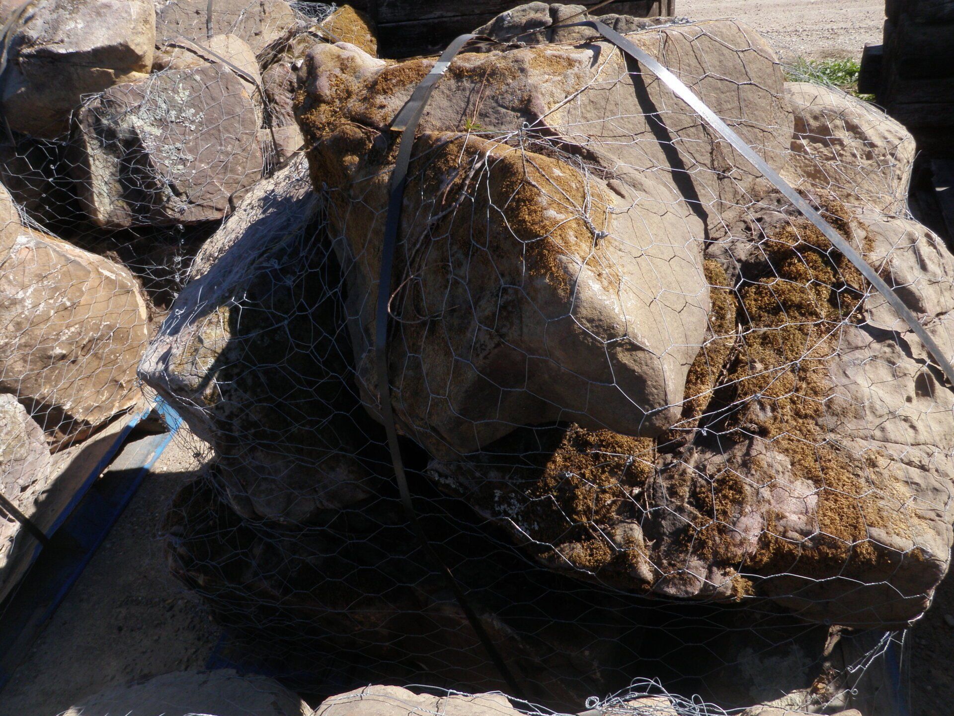 Three man size Arkansas Boulders