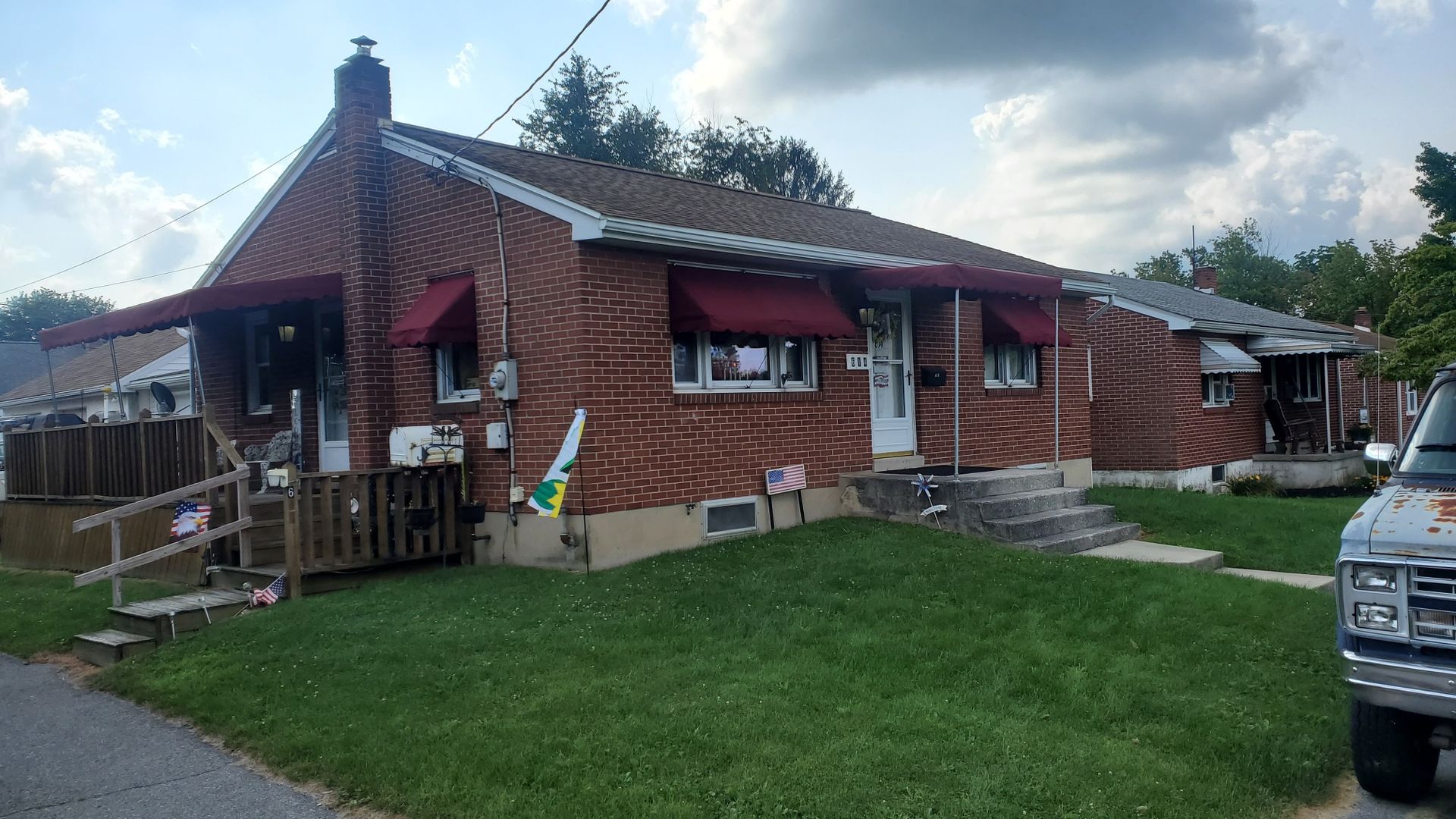 brick house with residential awnings