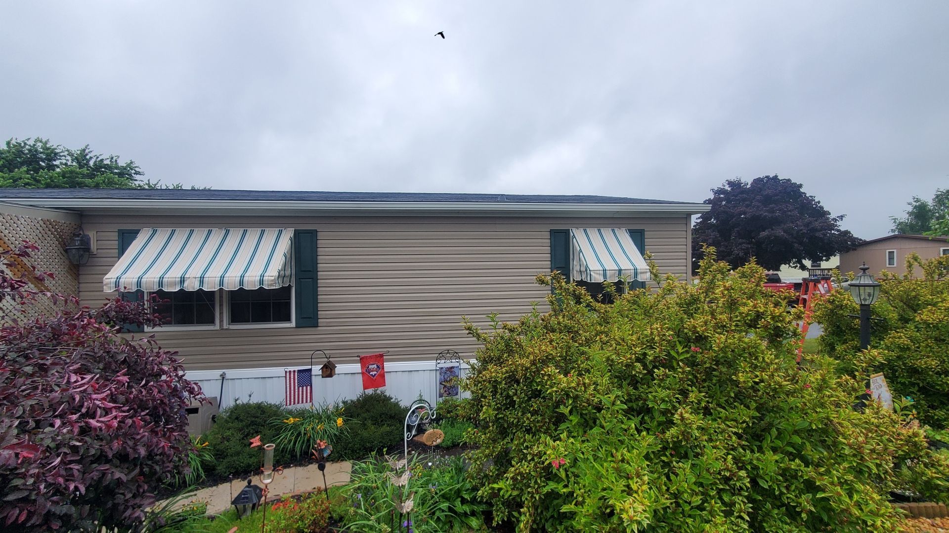 beige and blue residential window awnings
