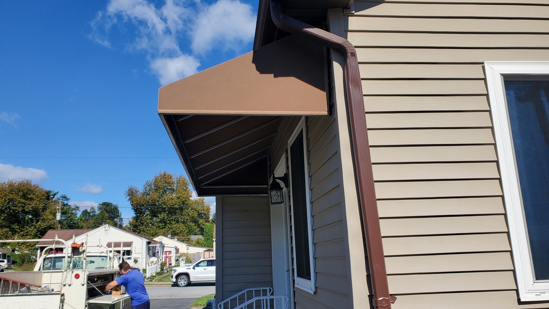 brown door and window residential awning