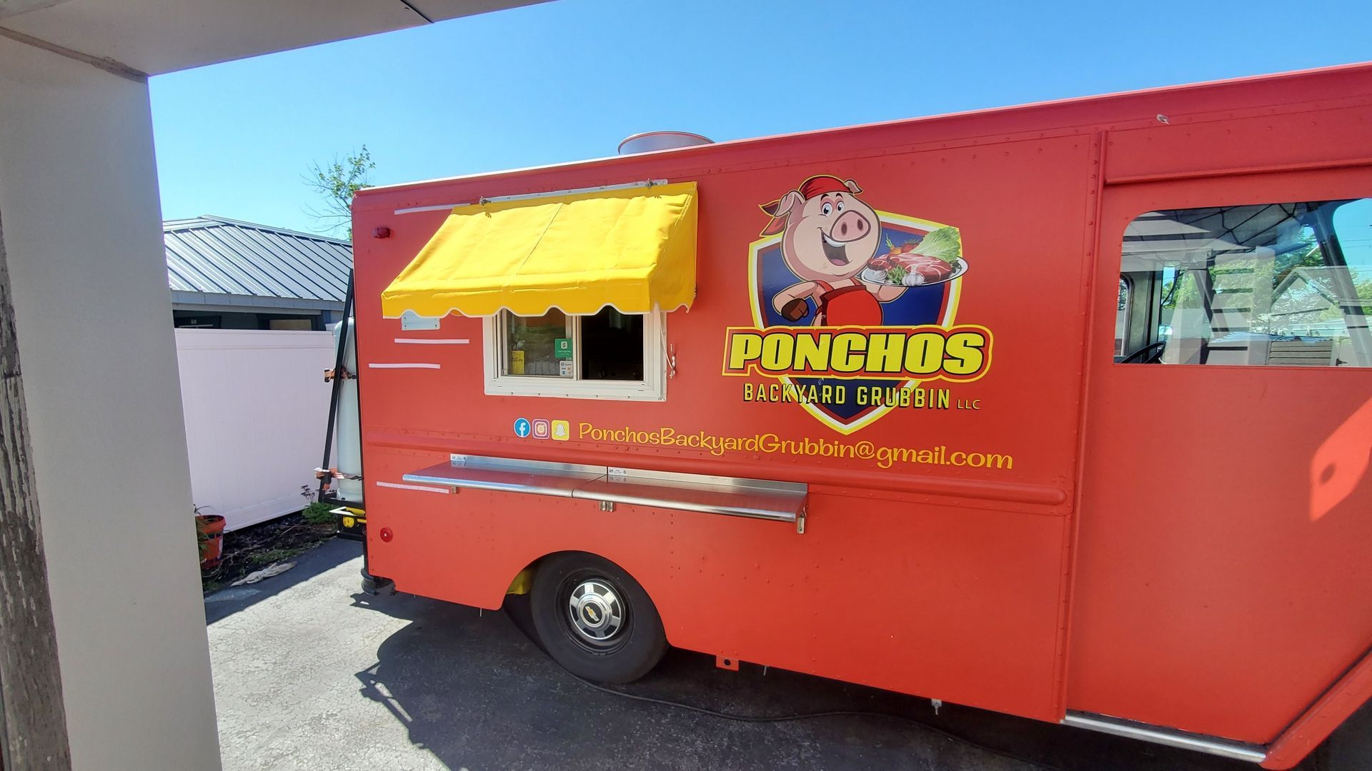 ponchos food truck yellow awning