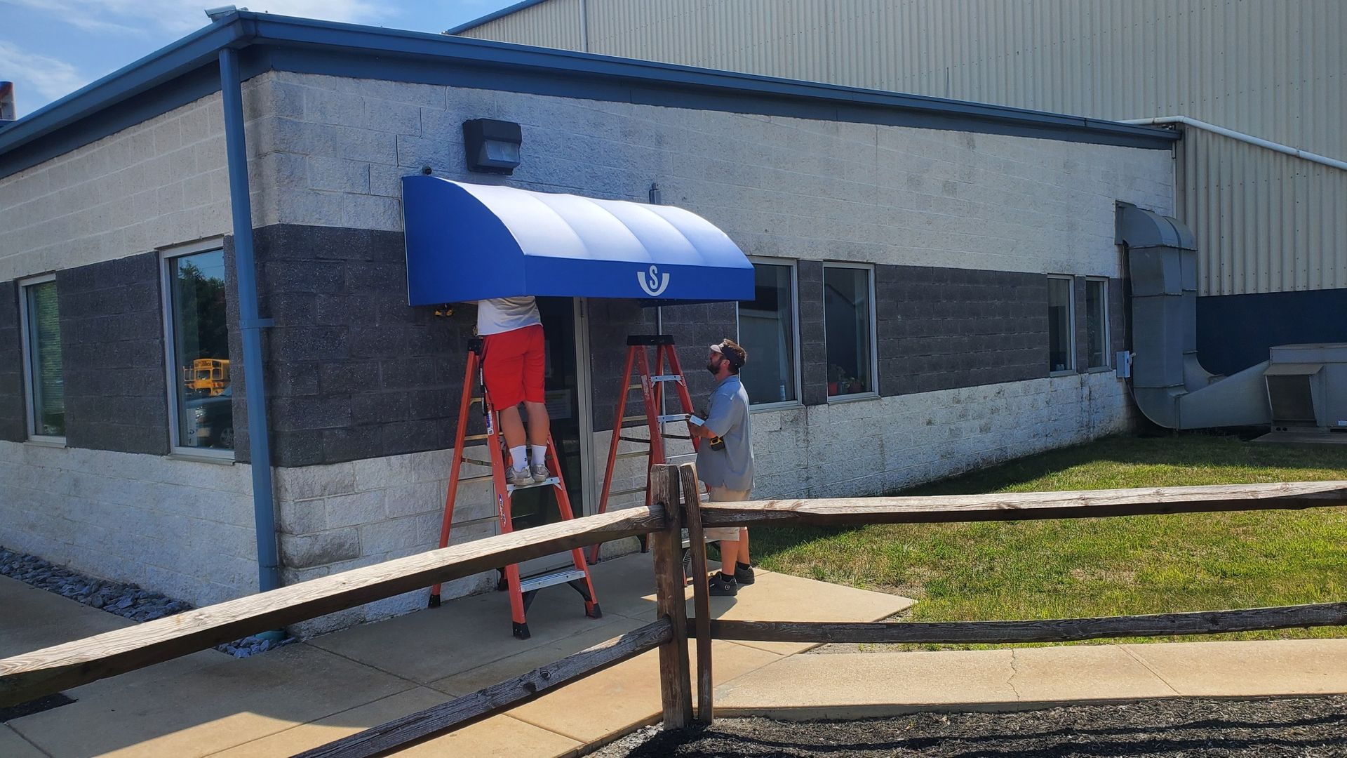 blue arched commercial awning