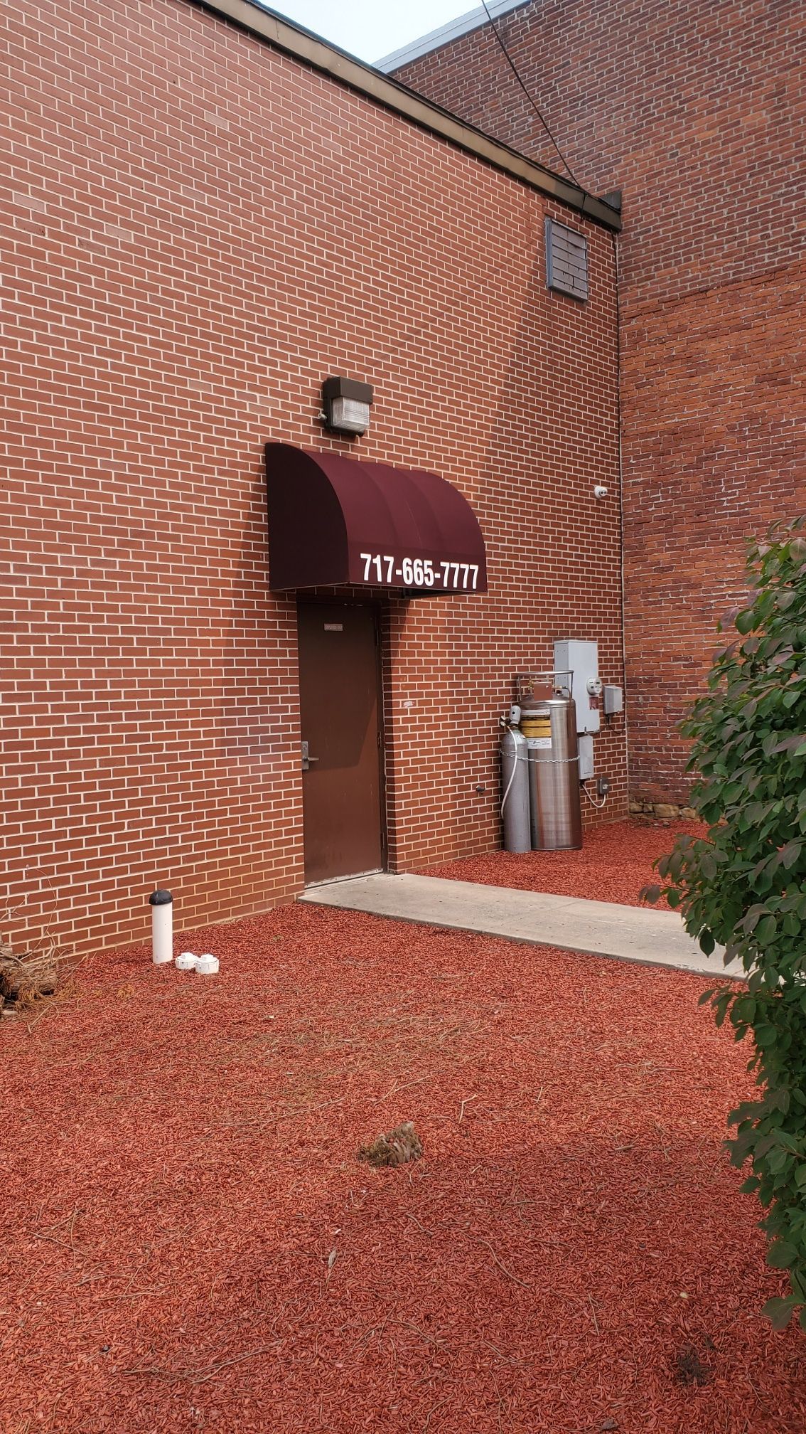 brown commercial door awning