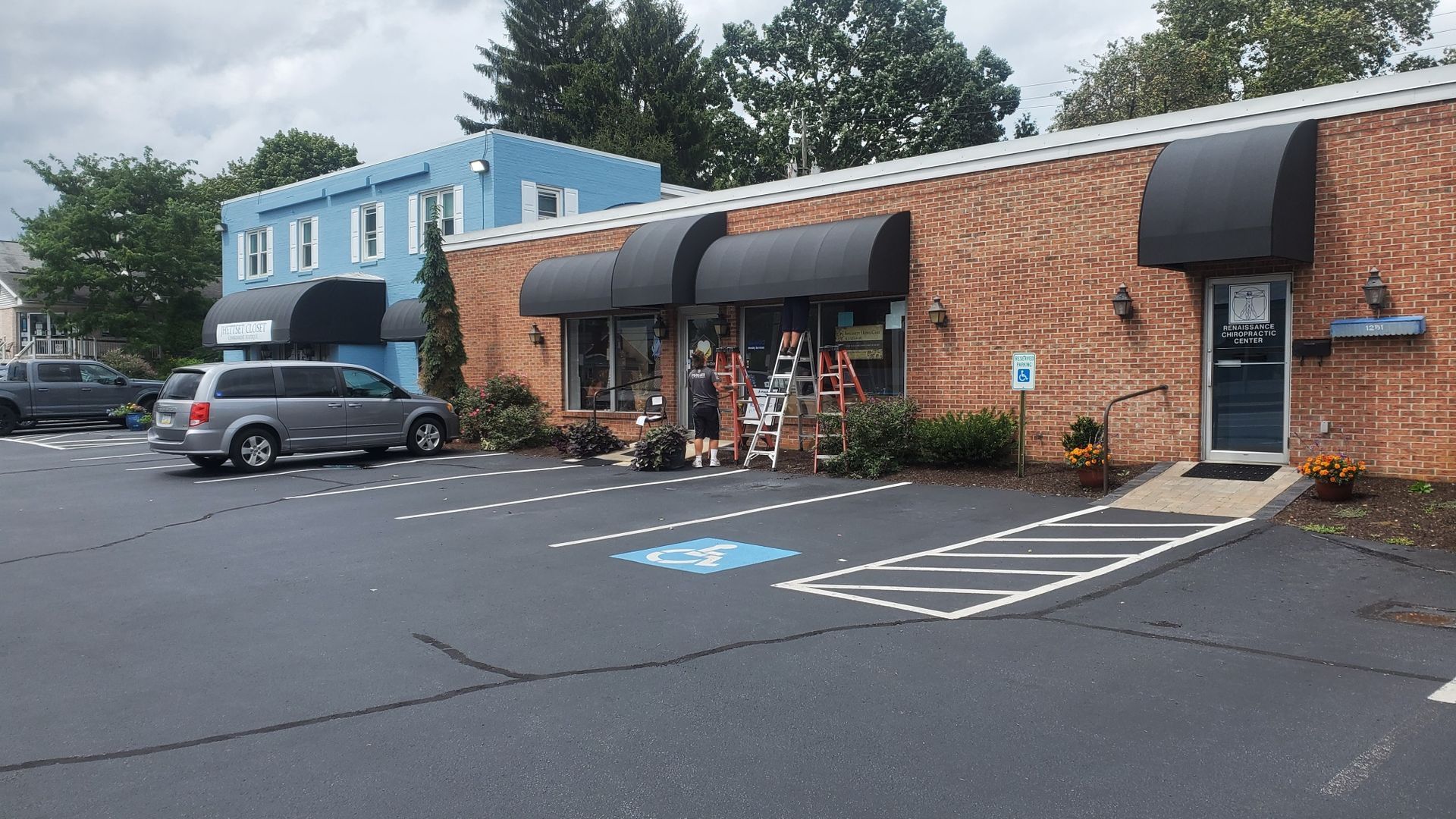 black commercial door and windows awning