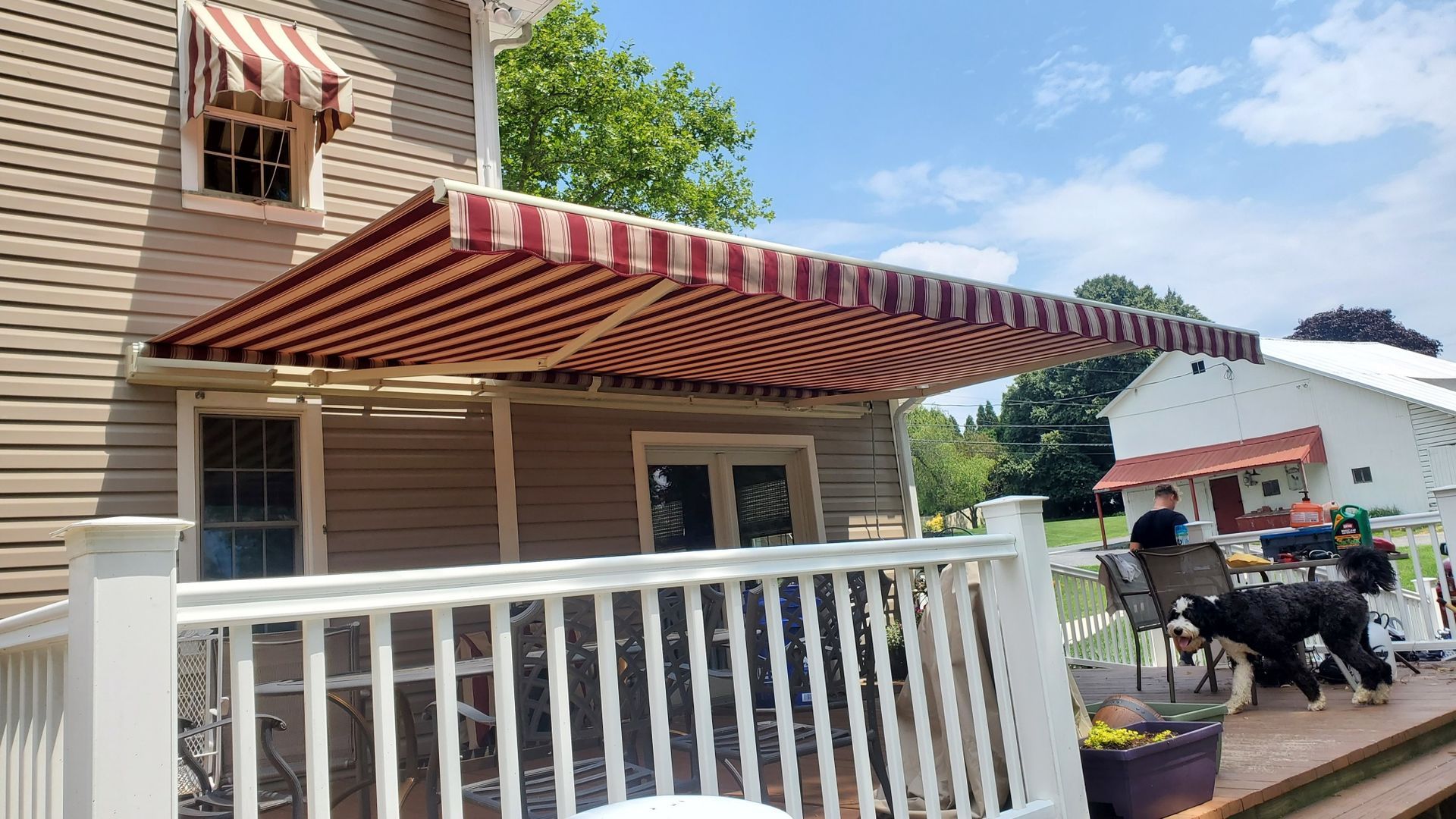 red and beige retractable awnings