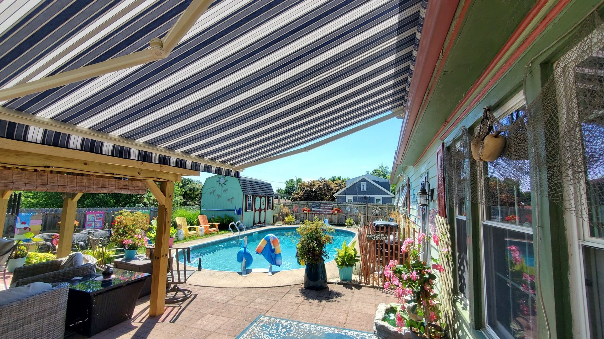retractable awnings beside the pool