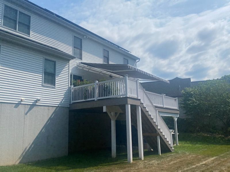 gray and white stripes retractable awnings