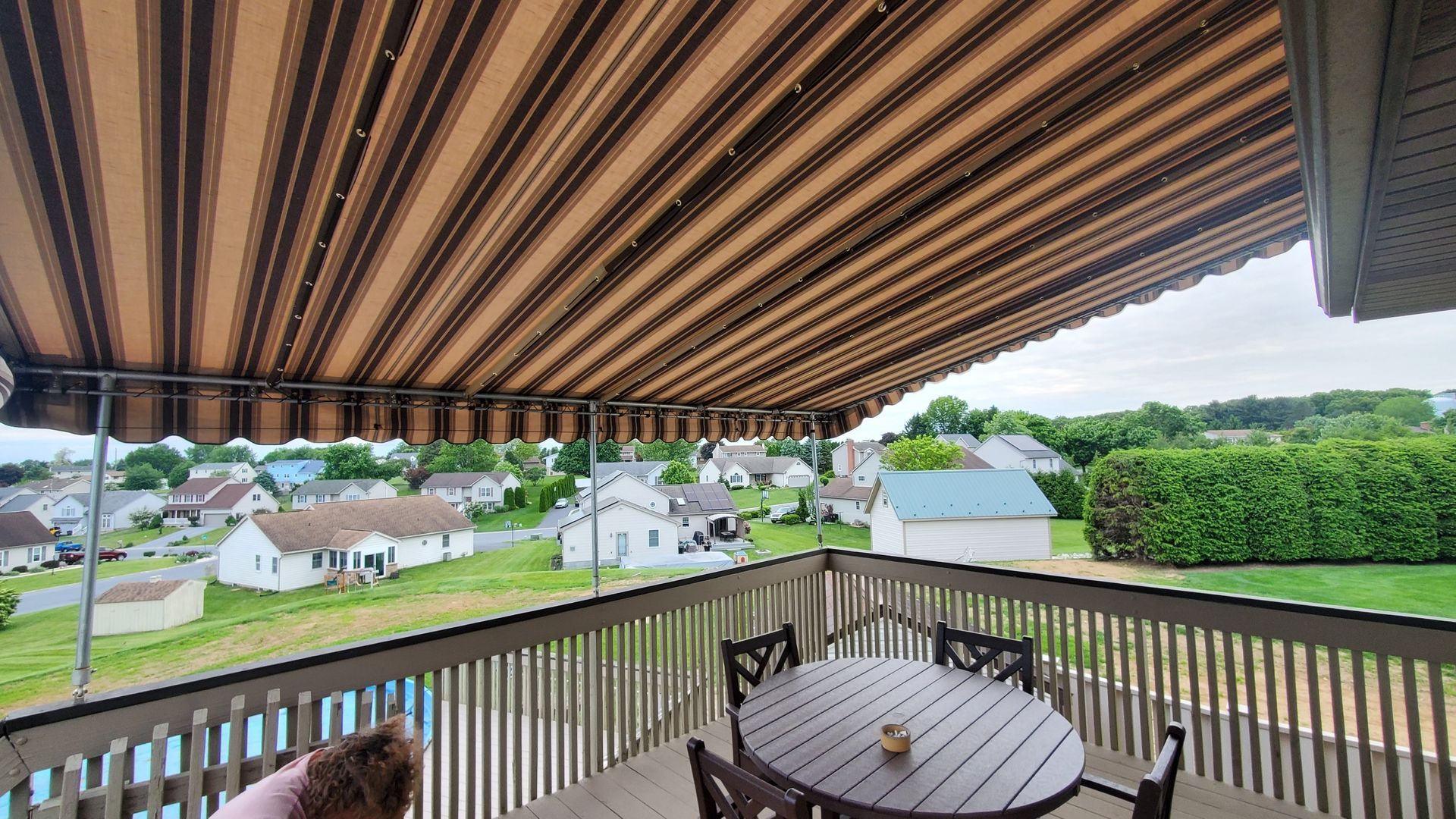 stripes stationary patio cover beside the pool