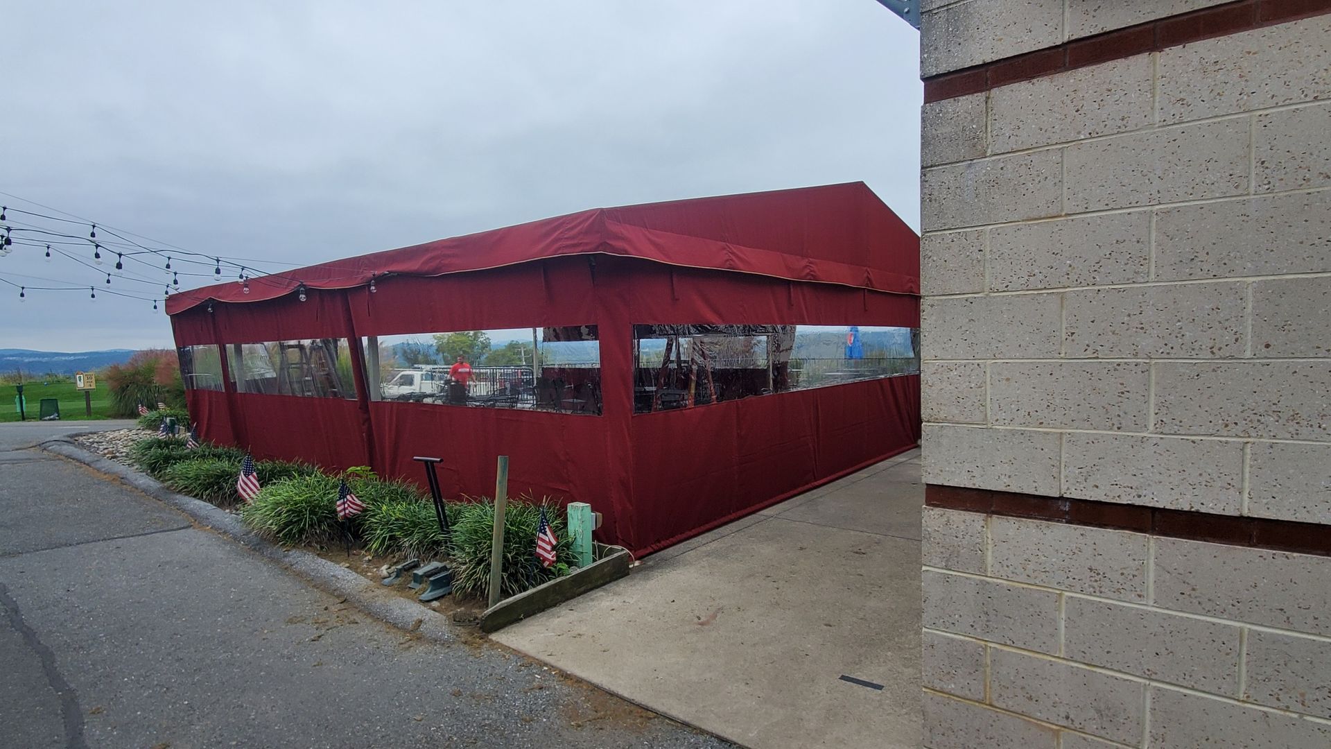 red tent roll up enclosure
