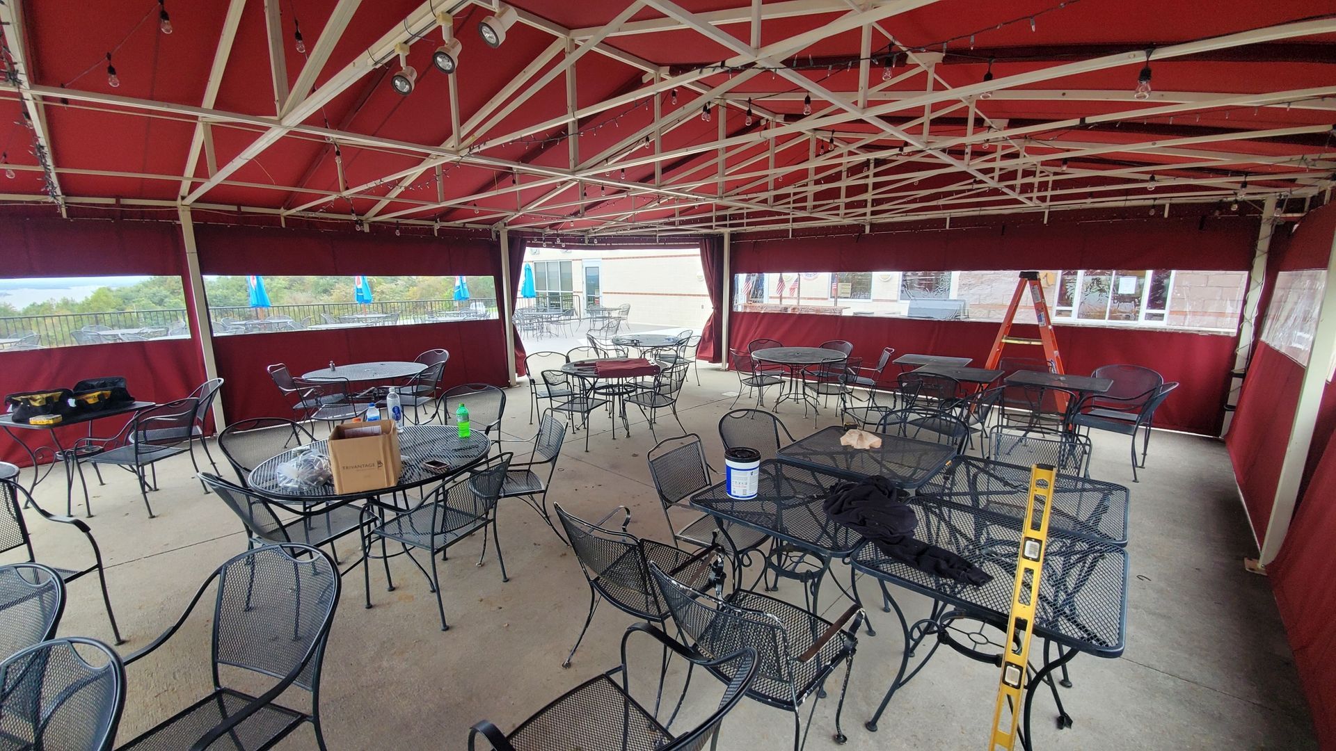 red tent roll up enclosure with plastic