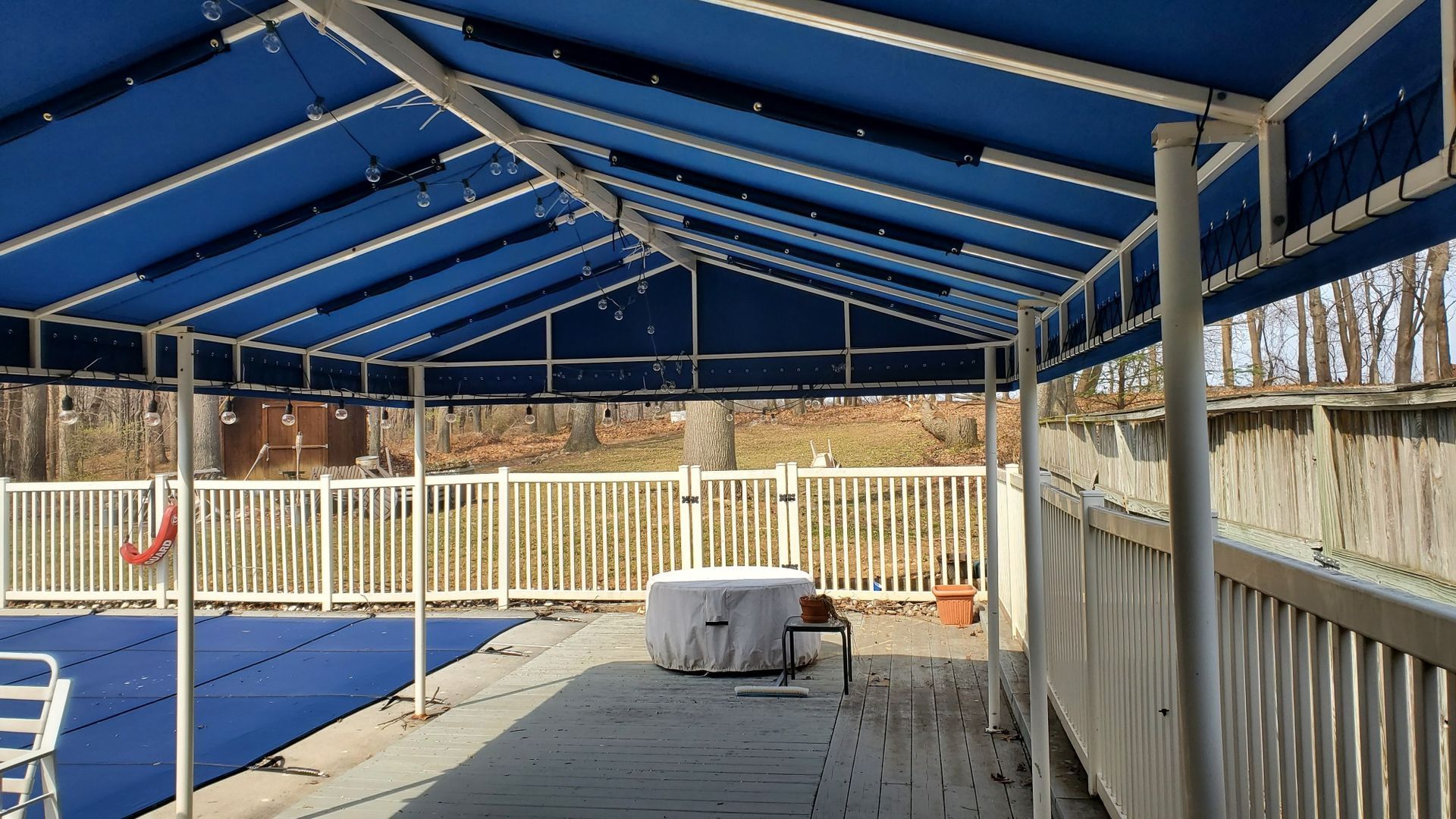 blue stationary tent pool side
