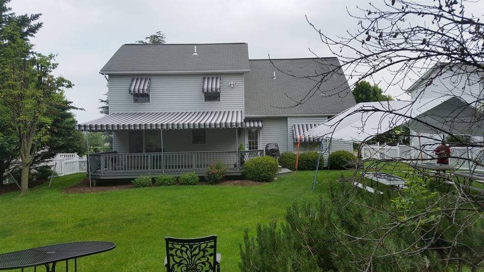 stripes stationary patio cover and window awnings