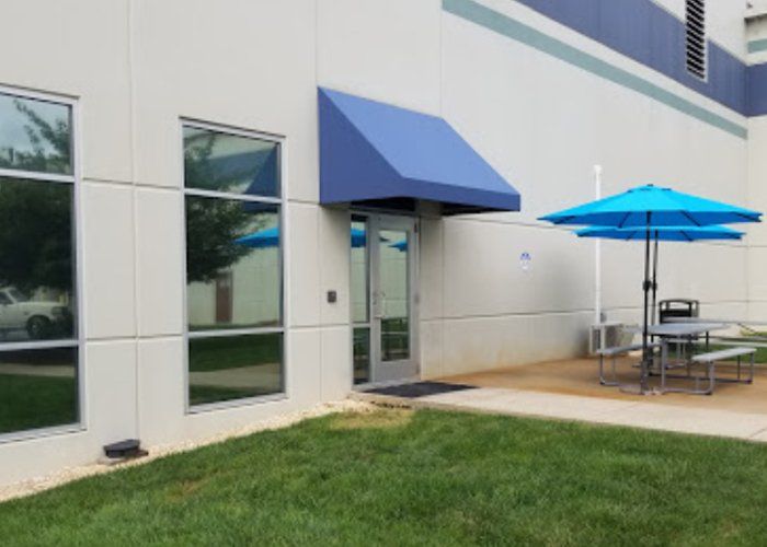 blue commercial door awning
