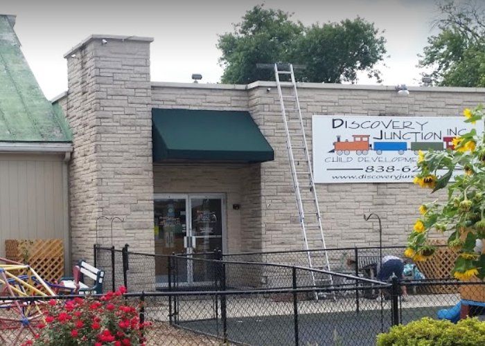 green commercial door awning