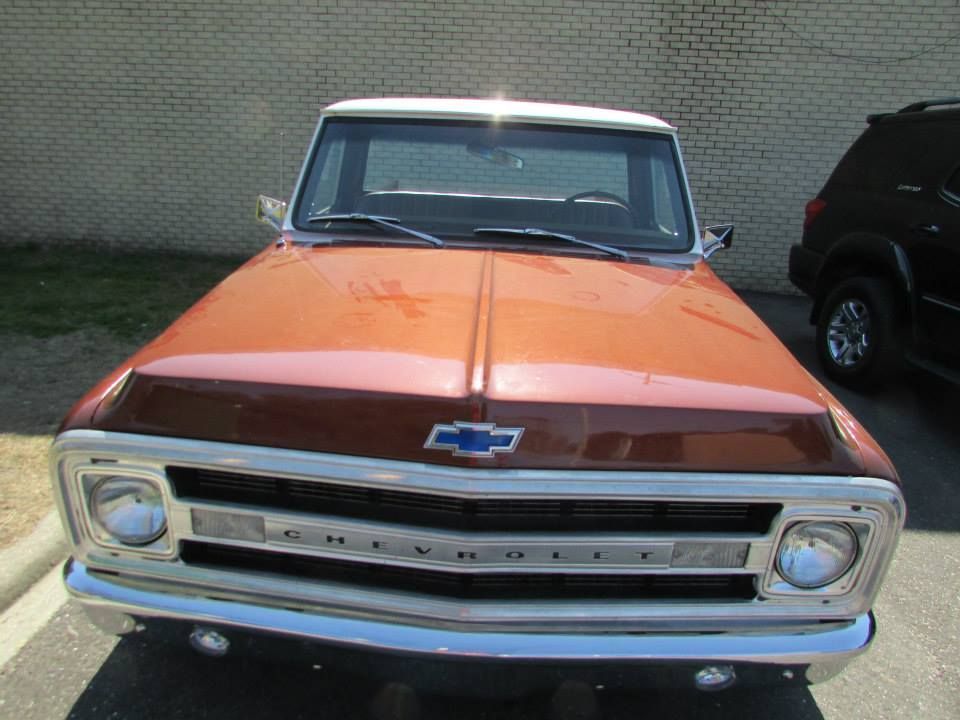 A chevrolet truck is parked in a parking lot