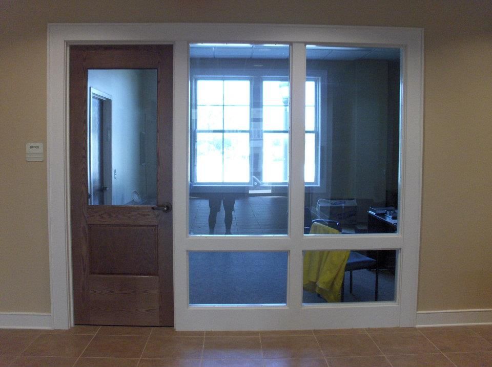 A room with a sliding glass door and a window