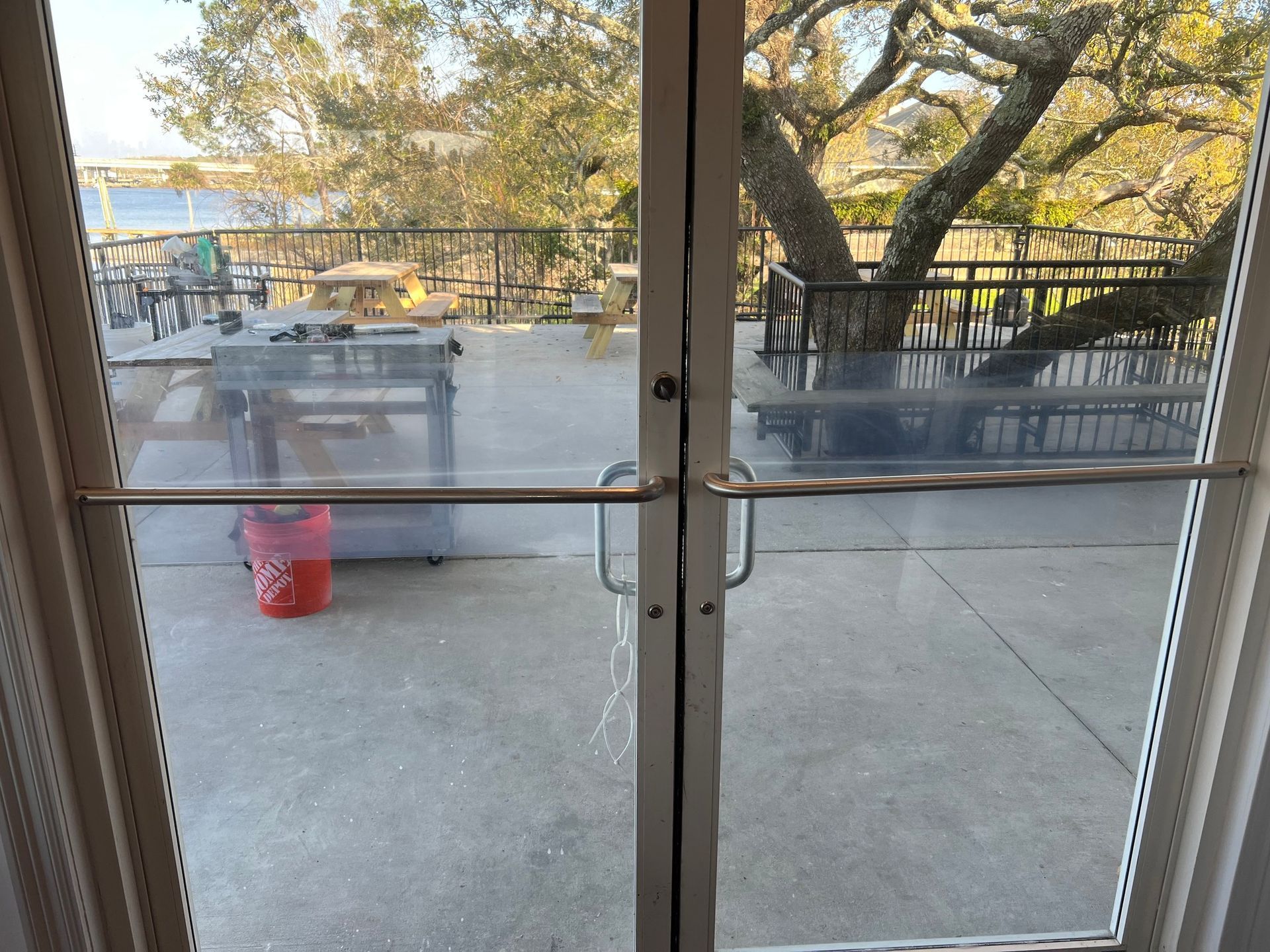 A view of a balcony through a glass door