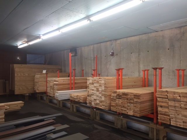A warehouse filled with wooden boards