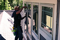 Man cleaning window