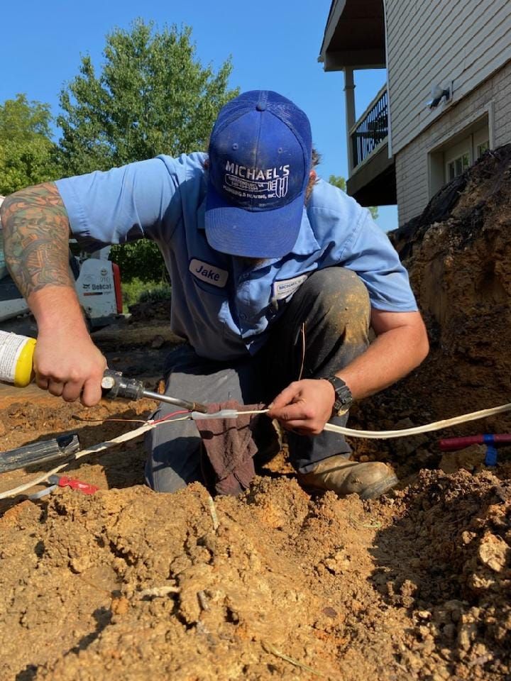 a man wearing a blue hat is working in the dirt