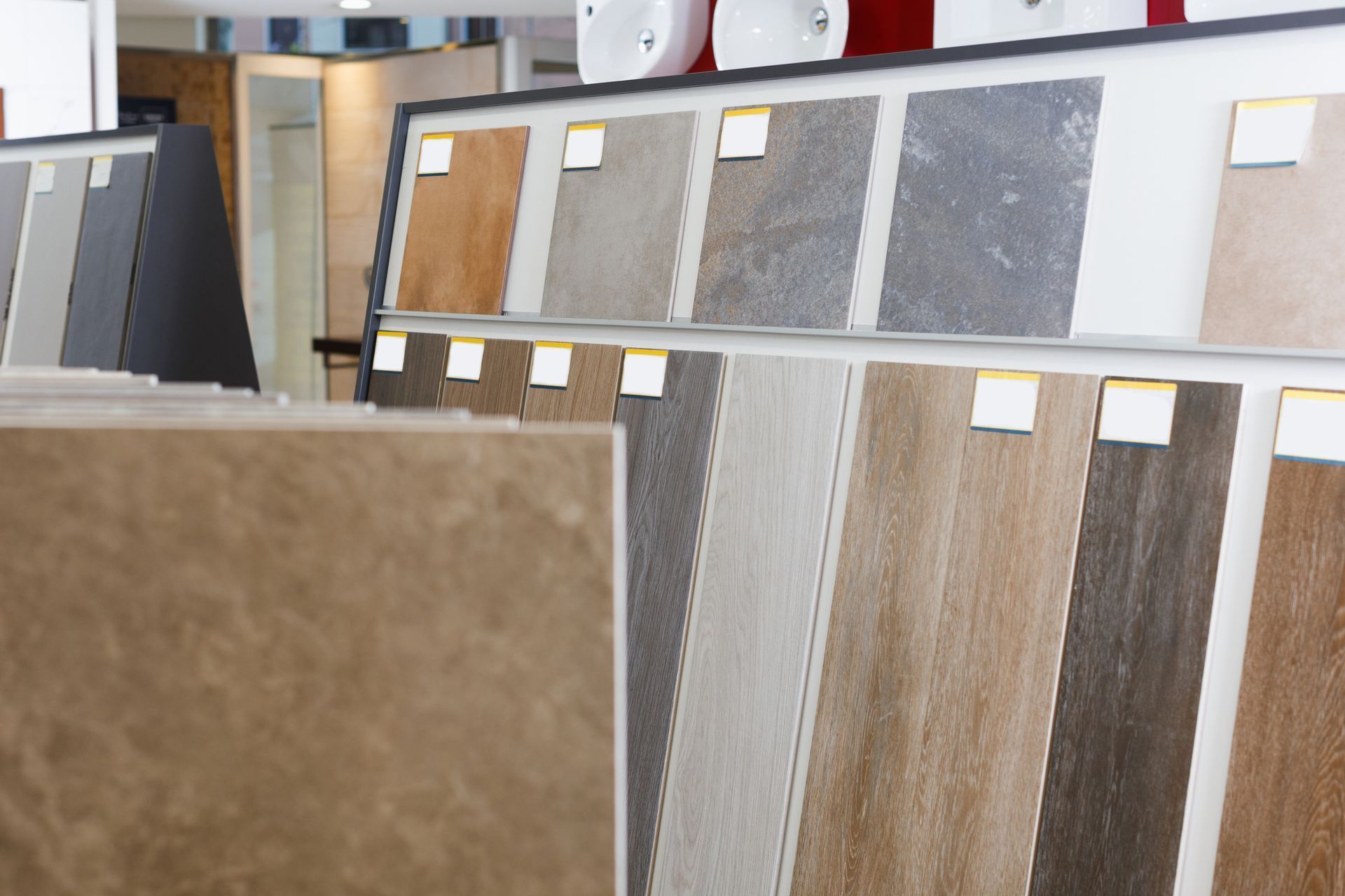 There are many different types of tiles on display in a store.