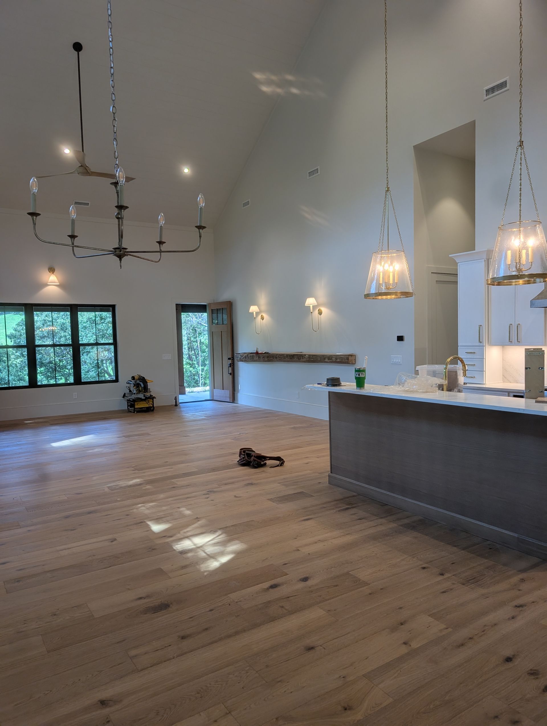 Spacious, light-filled room with hardwood floors