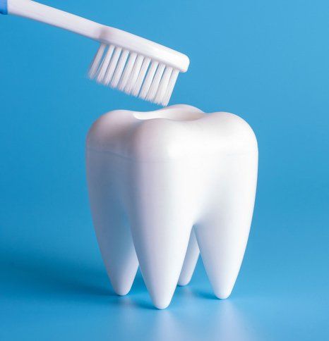 Toothbrush and a tooth