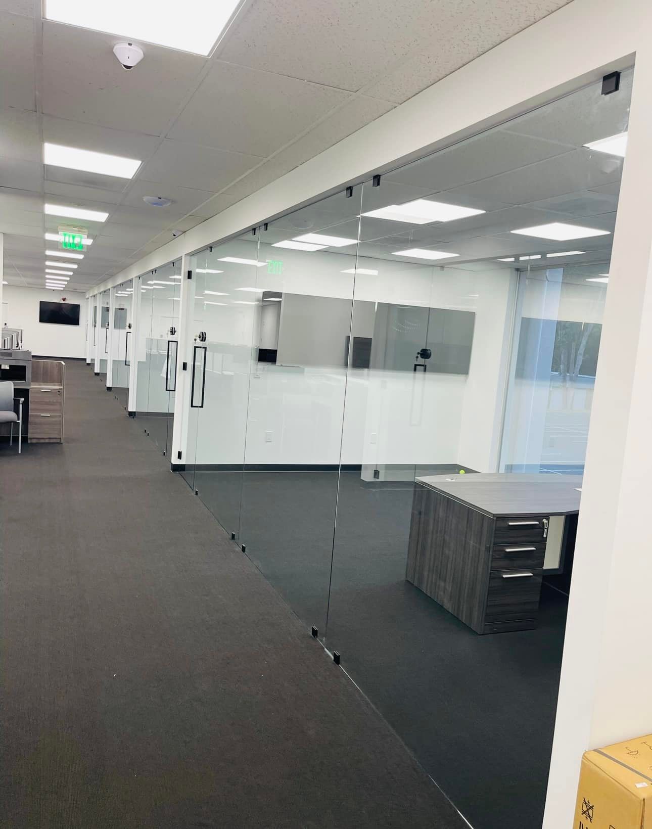 A large office building with a lot of glass doors