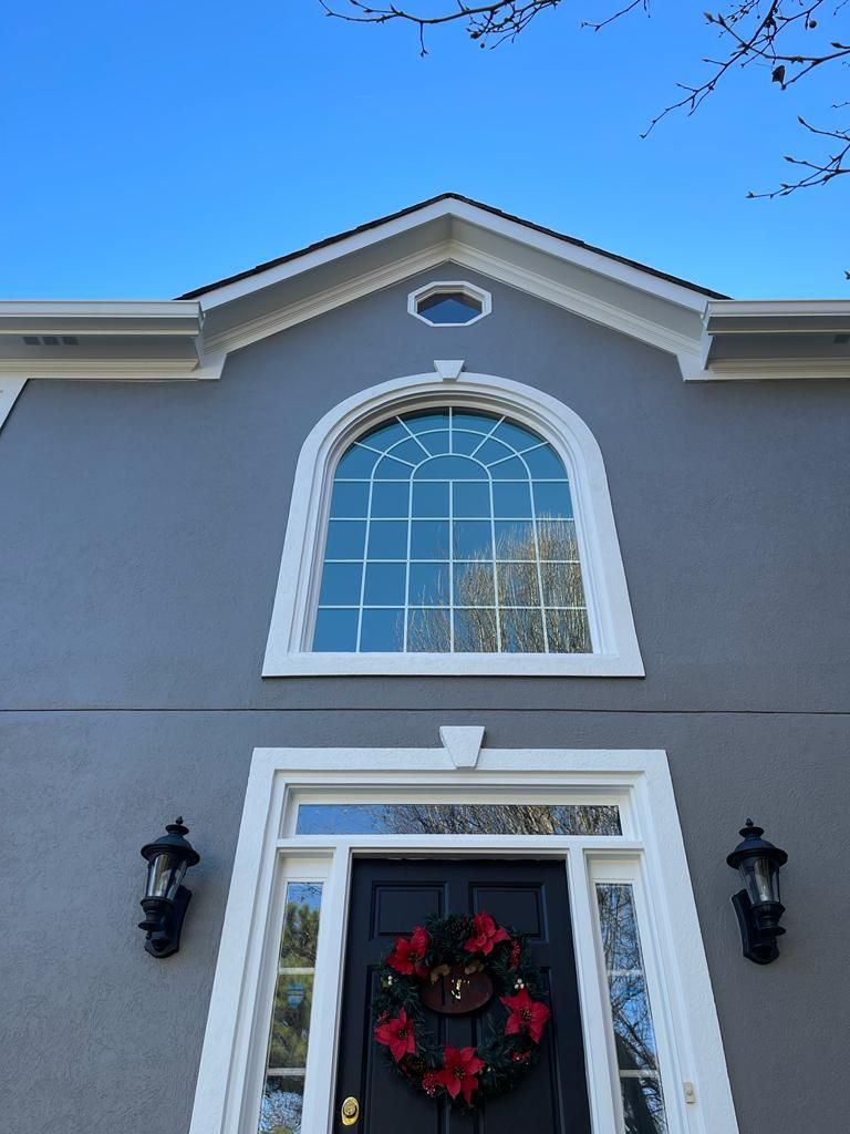 The front door of a house with a christmas wreath on it