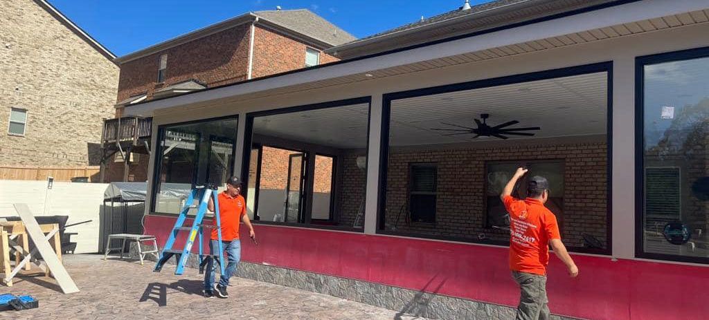 A group of people are standing in front of a building.
