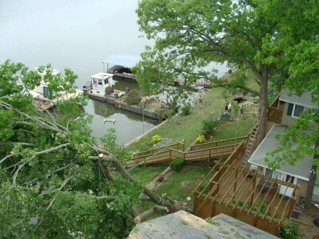 An aerial view of a house next to a body of water.