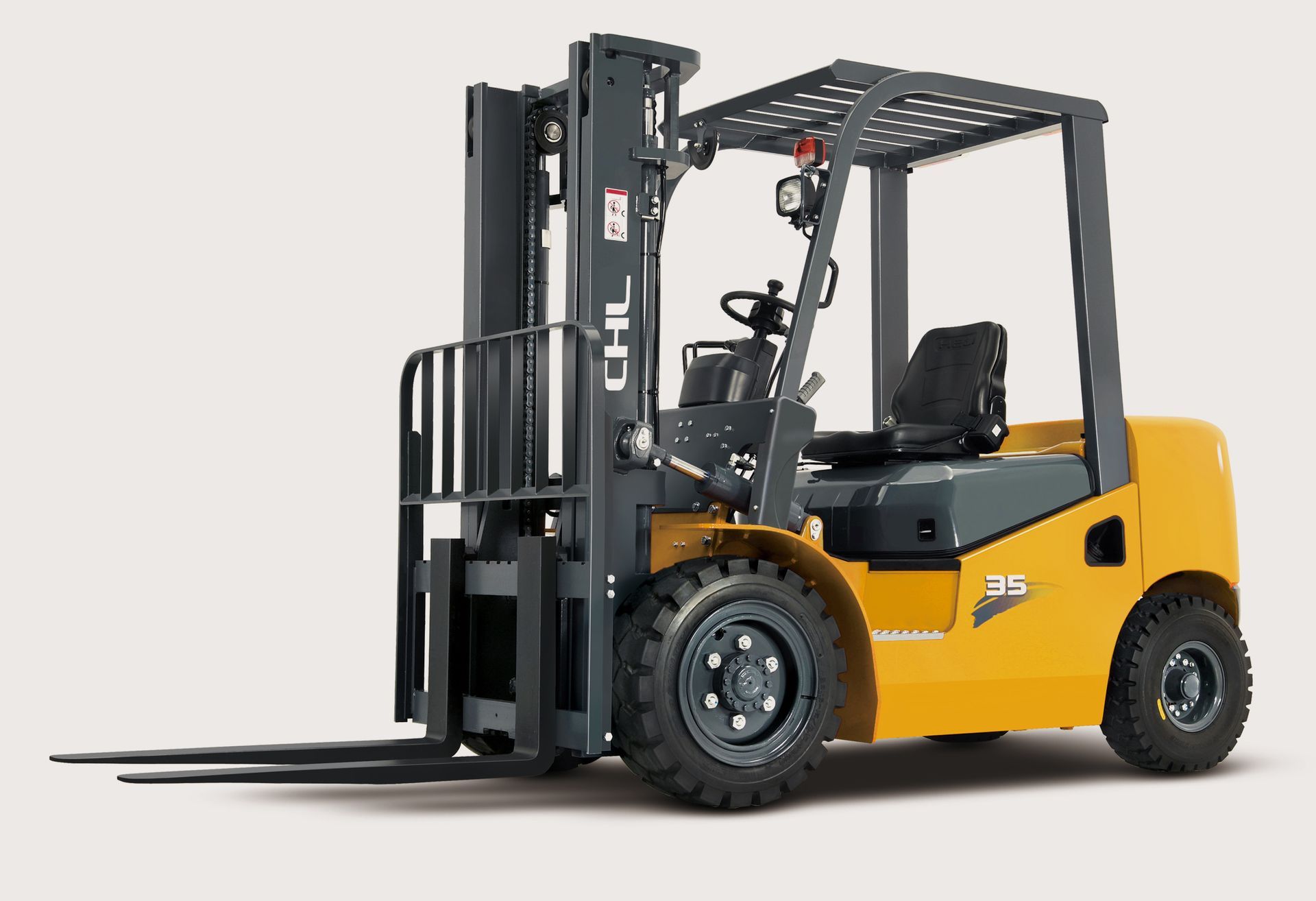 Yellow and black forklift on a white background, side view with raised forks