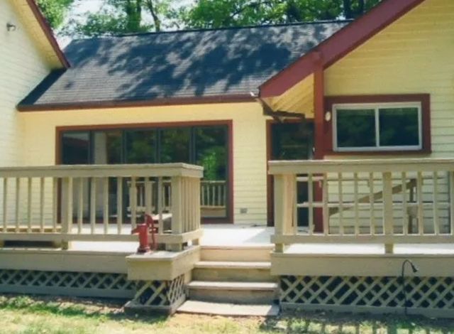 The back of a house with a deck and stairs