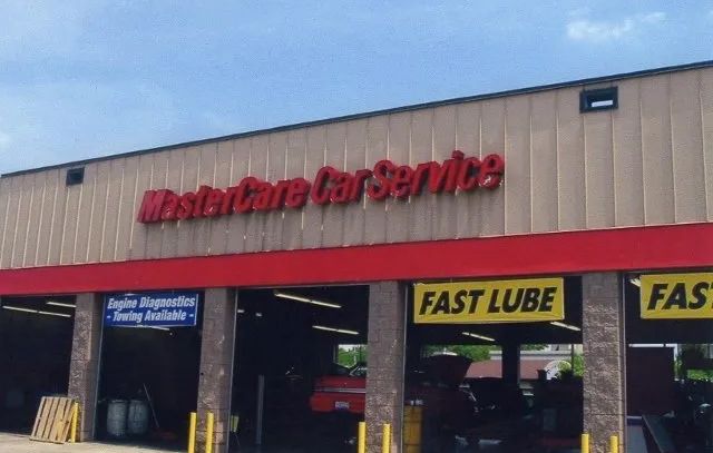 A mastercare car service with a fast lube sign