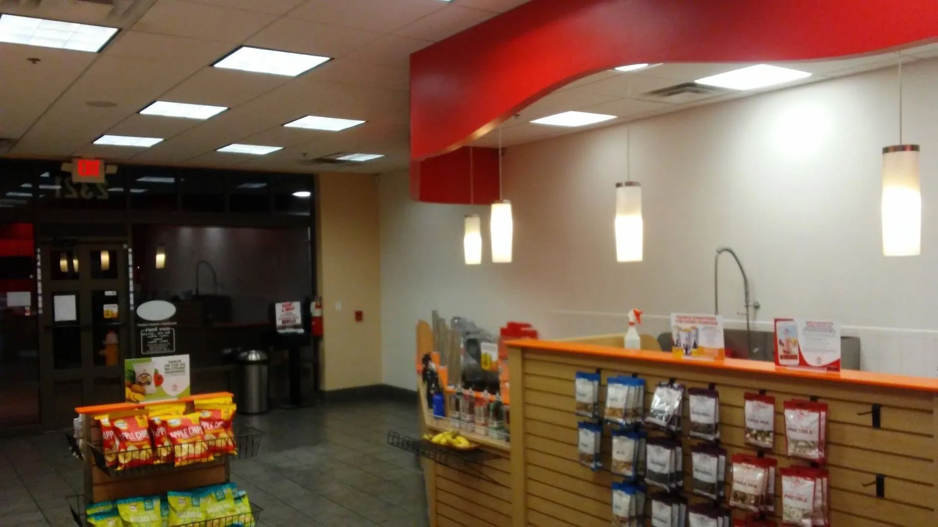 A store with a counter and a display of snacks