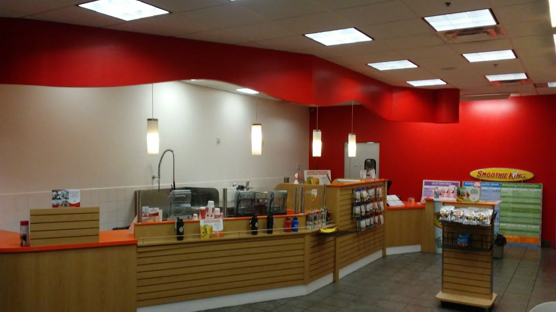 The inside of a store with a sign that says 'pharmacy' on it