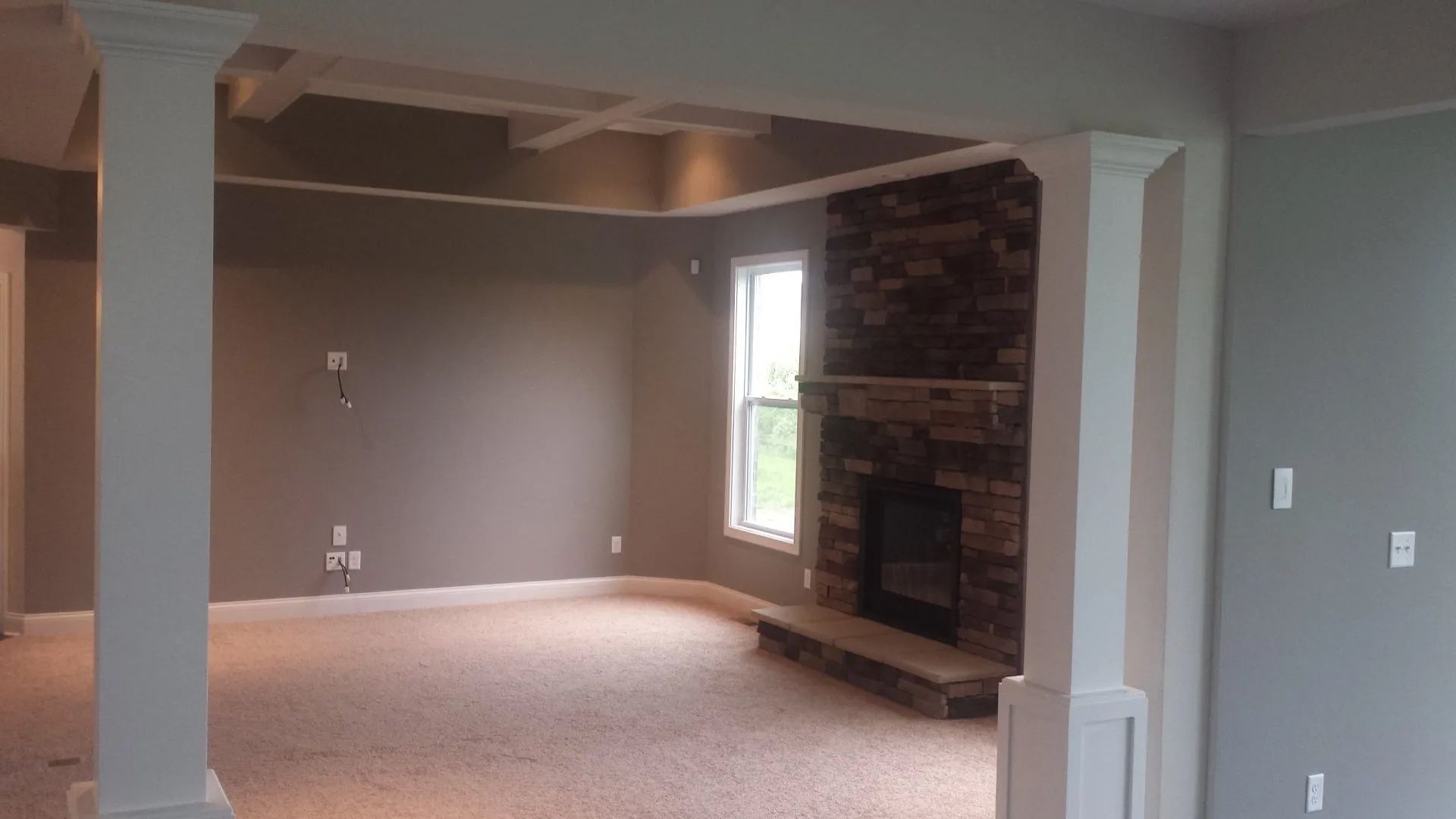 There is a fireplace in the middle of the room.