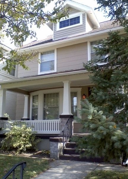 A house with a large porch and stairs