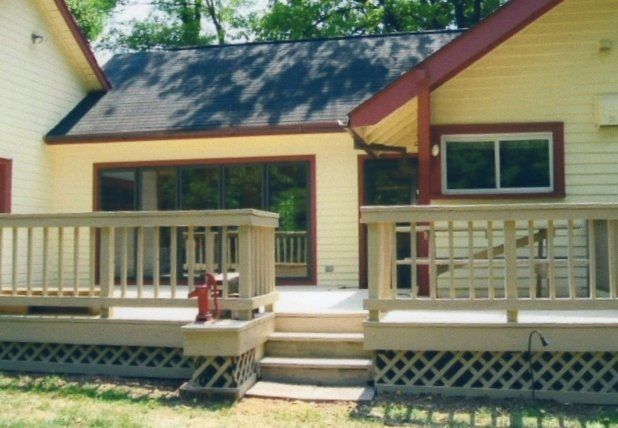 The back of a house with a deck and stairs