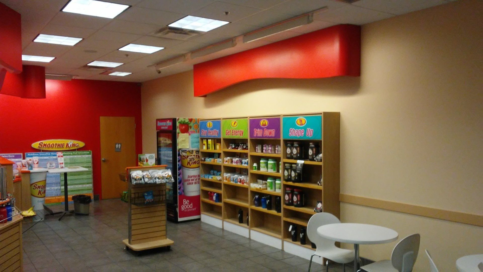 The inside of a store with shelves and tables
