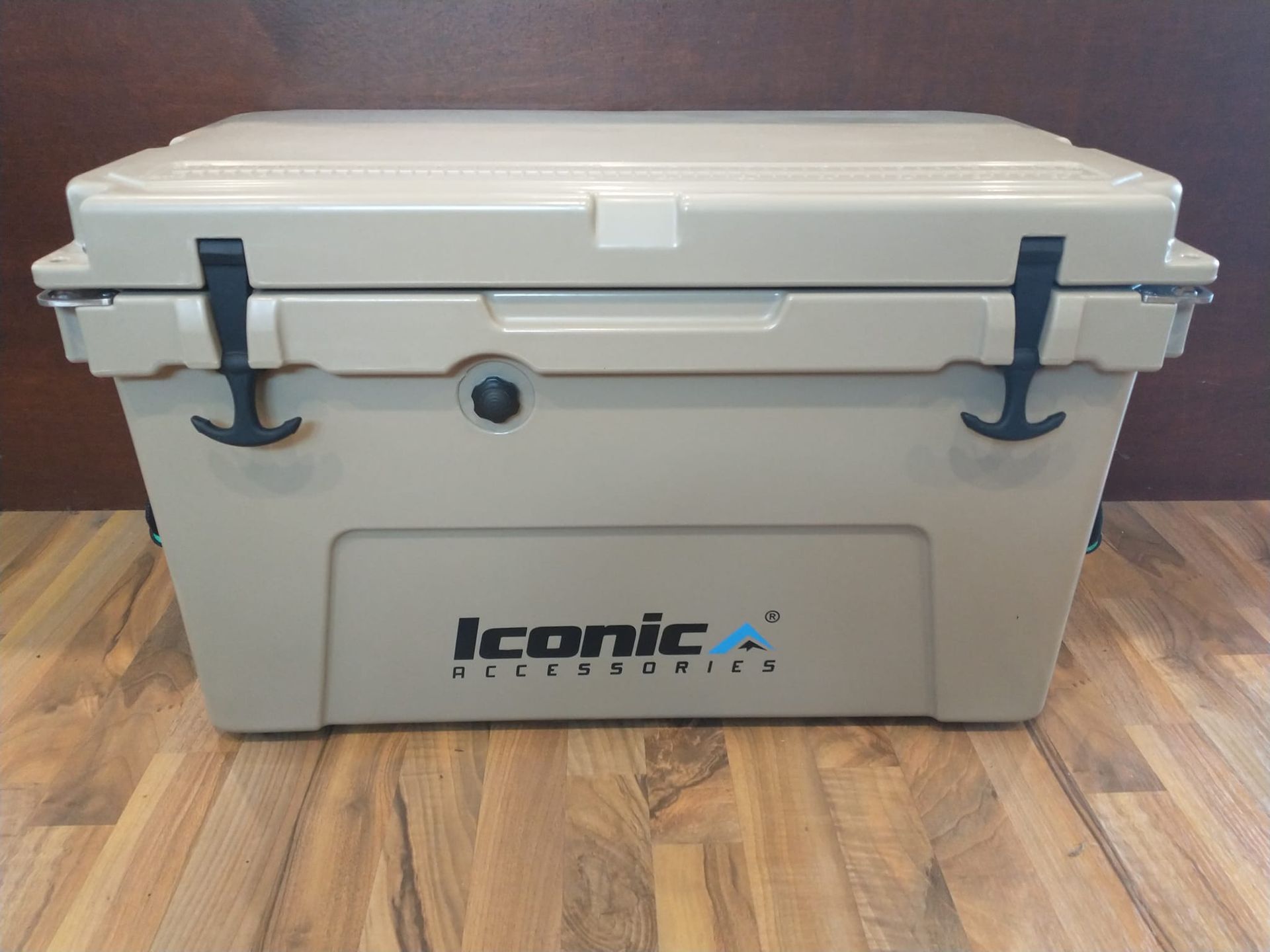 An iconic cooler is sitting on a wooden table