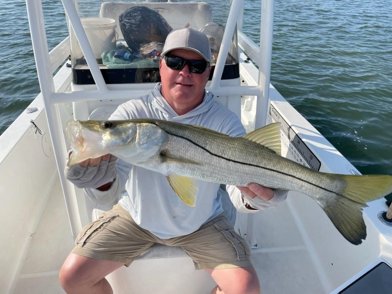 man holding angler catch