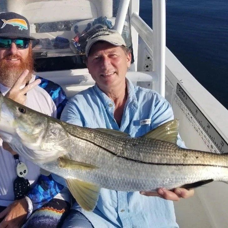 two men with big fish catch