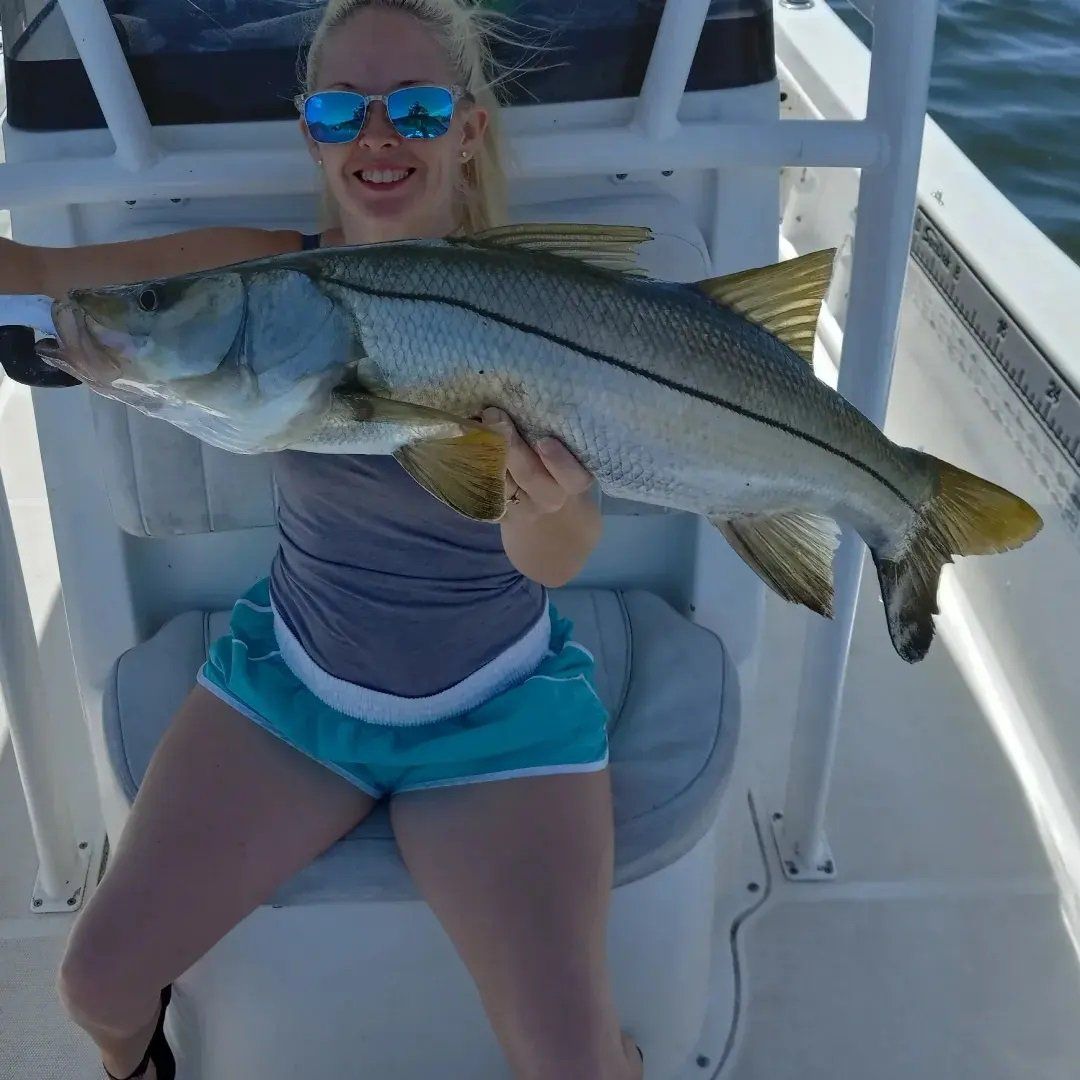 woman with big fish catch
