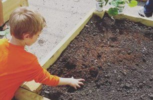 Child playing with soil
