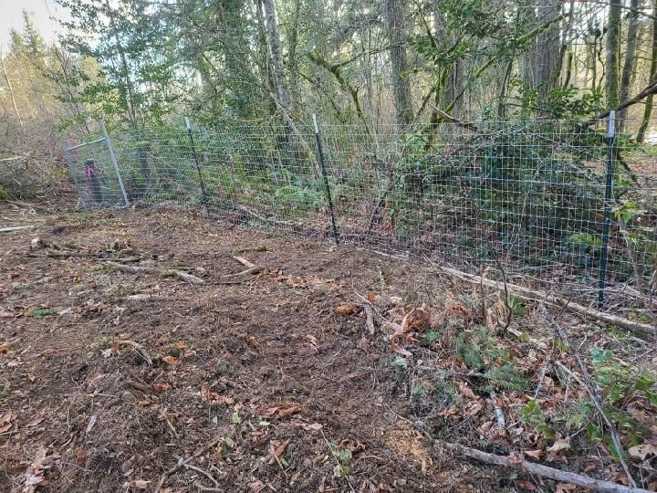 A fence in the middle of the farm