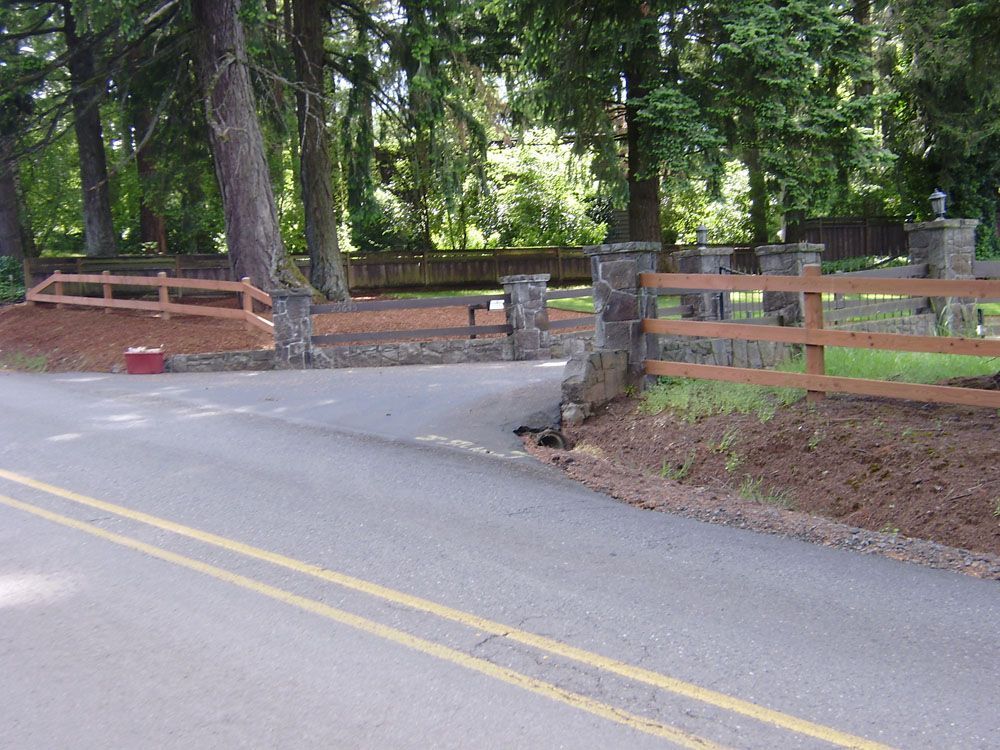 A well-made fence along the side of a road