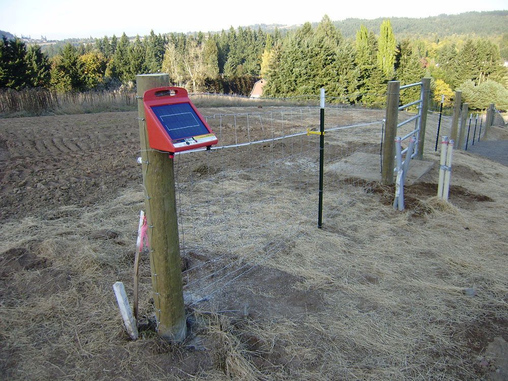 A wooden post with fence