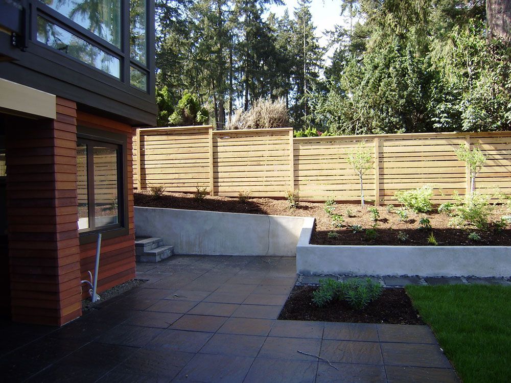 A house with a wooden fence surrounding it